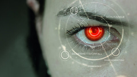 IT-Sicherheit_Themenseite Header Header-Motiv IT-Sicherheit mit einem rot gefärbten Auge in Großaufnahme und Illustration zumThema
