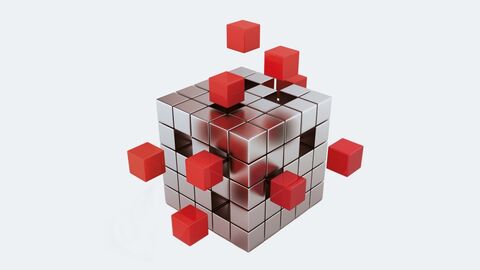Metallisch schimmernder Kubus und zahlreichen, einzelnen Würfeln. Einige kleine Würfel sind rot und schweben losgelöst neben dem Kubus.