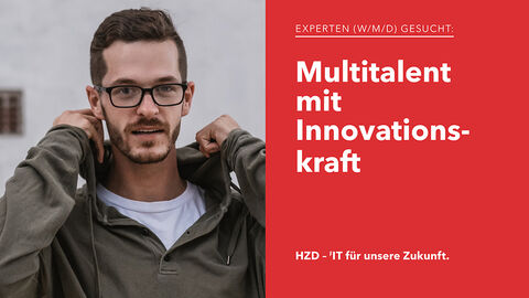 Porträt eines sympathisch aussehenden IT-Experten mit Dreitagesbart und Hoodie