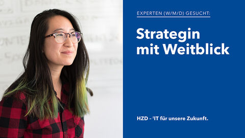 Strategin mit Weitblick – die perfekte Besetzung für Stellenangebote der HZD Porträt einer sympathisch aussehenden IT-Expertin mit bunt gefärbten Haaren und Holzfällerhemd