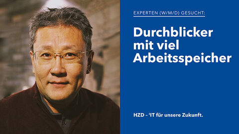Durchblicker mit viel Arbeitsspeicher – die perfekte Besetzung für Stellenangebote der HZD Porträt eines sympathisch aussehenden IT-Experten mit kurzen grauen Haaren und randloser Brille