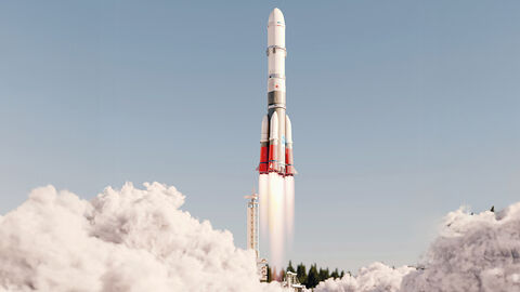 Start einer weiß-roten Rakete, deren weiße Dampfwolken von einem strahlend blauen Himmel kontrastiert werden